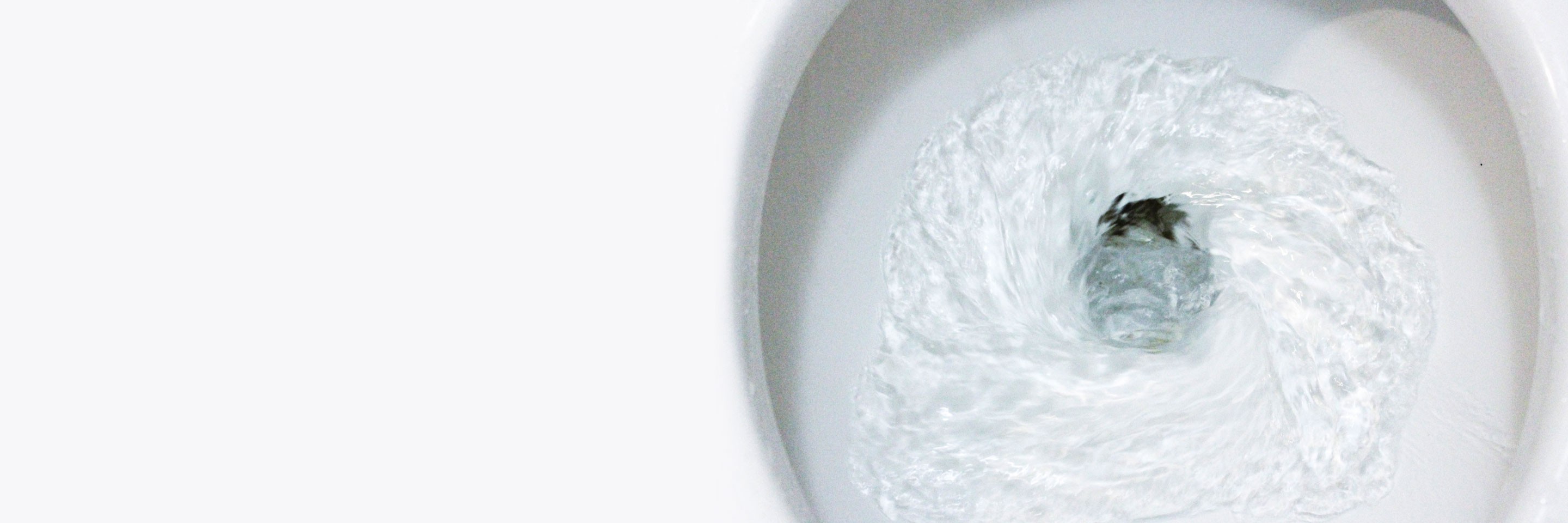 selective focus close up flushing toilet bowl for sanitary, Toilet, Flushing Water, close up, water flushing in toilet, A photo of a white ceramic toilet bowl in the process of washing it off. Ceramic sanitary ware for correcting the need with an automatic flushing device