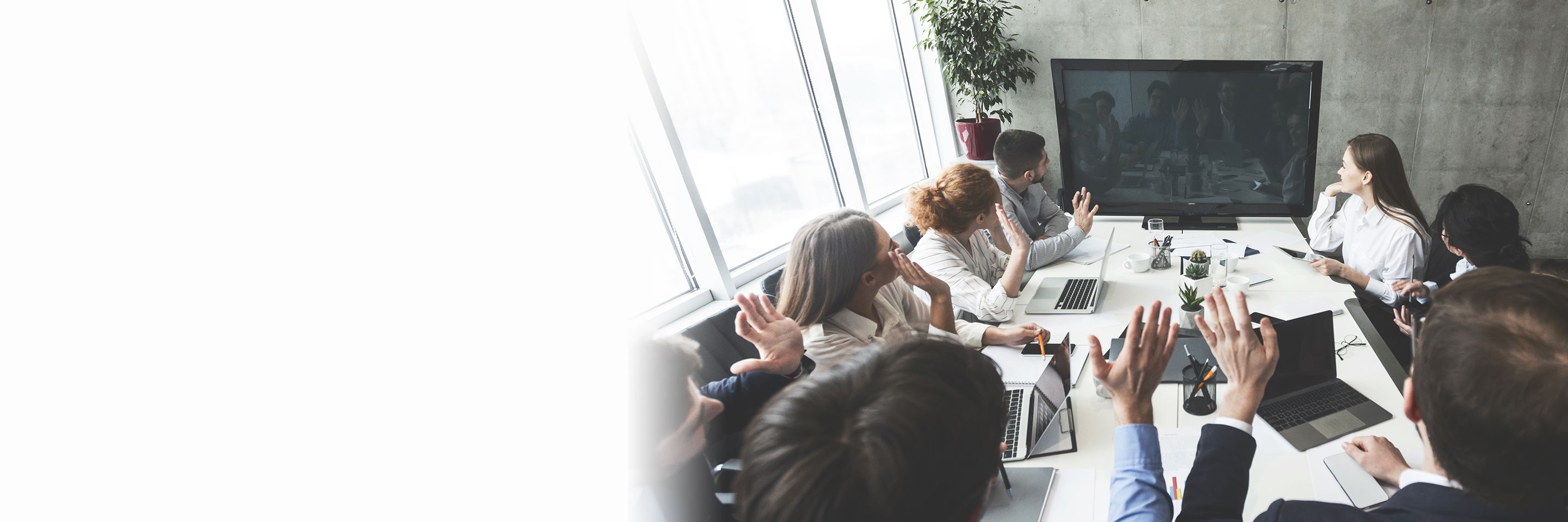 Businesspeople watching online presentation on tv screen